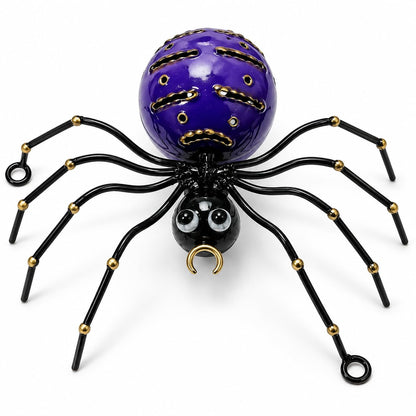 Violette dekorative Metallspinne mit schwarzen Beinen und goldfarbenen Details
