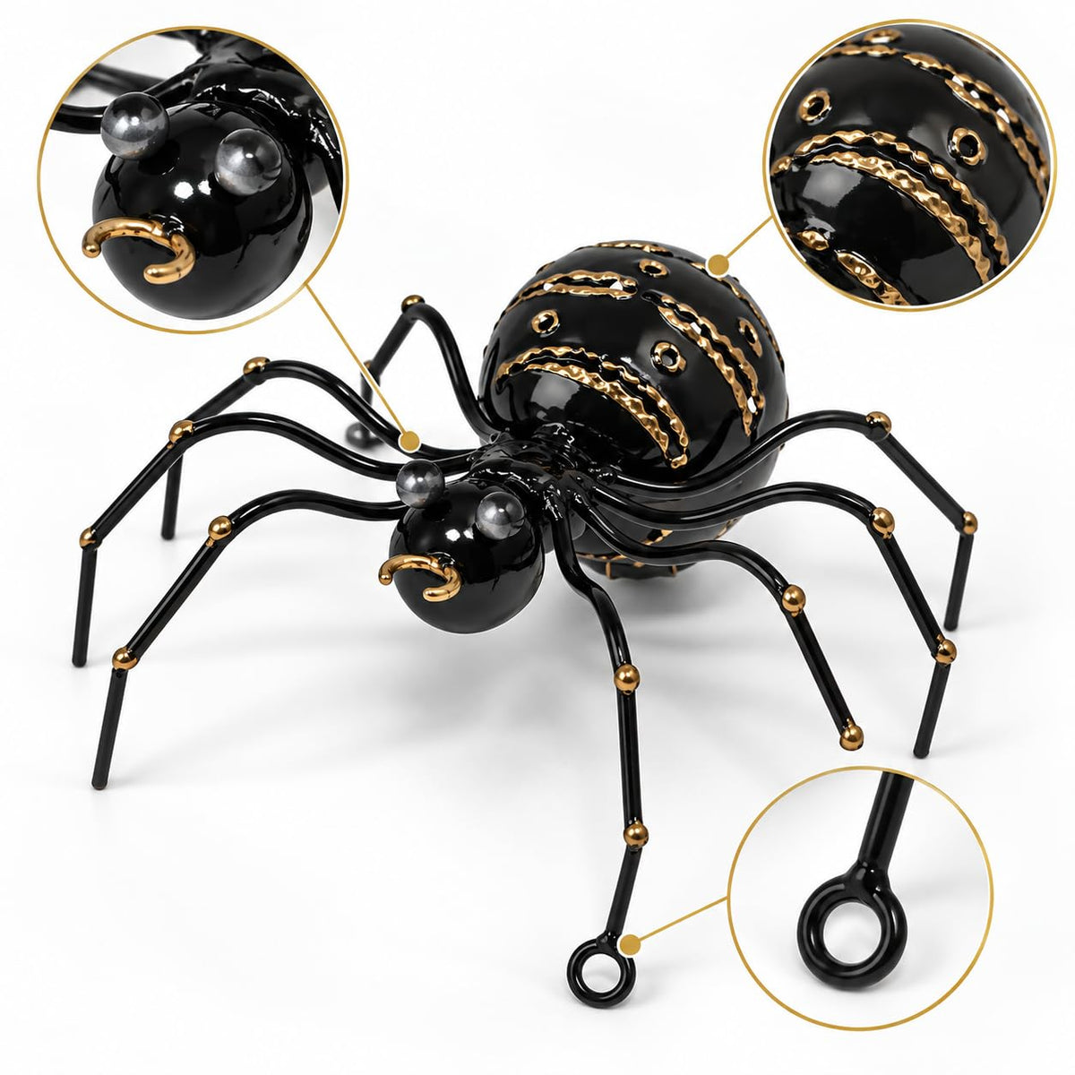Detailansicht: Schwarze dekorative Metallspinne mit goldfarbenen Verzierungen