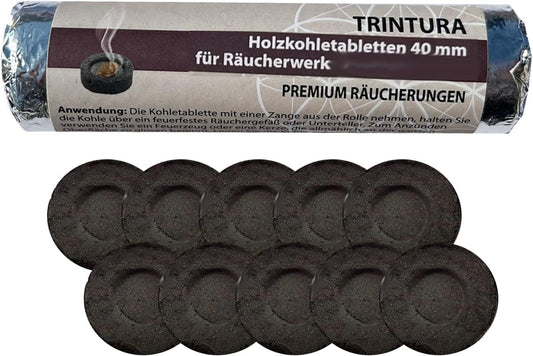 Rolle mit Aufschrift Räucherkohle 40 mm neben zwei Reihen schwarzer Kohletabletten